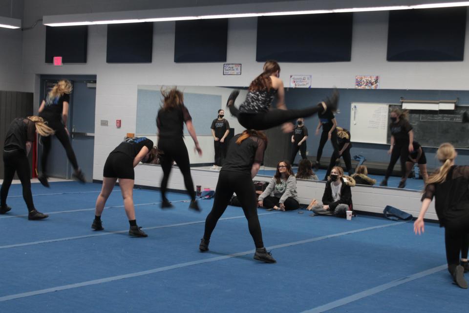 Members of the Cambridge High Dance Team practice the jumps in their hip-hop routine as they prepare to compete in the National Dance Competition at The Disneyland Resort in Florida.