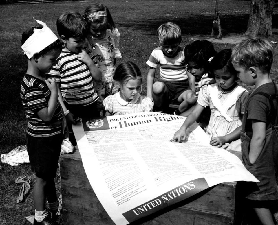 Children of the United Nations International Nursery School look at a poster of the Universal Declaration of Human Rights. <a href="https://www.gettyimages.com/detail/news-photo/photograph-taken-of-children-of-the-united-nations-news-photo/929284776?adppopup=true" rel="nofollow noopener" target="_blank" data-ylk="slk:Universal History Archive/Universal Images Group via Getty Images;elm:context_link;itc:0;sec:content-canvas" class="link ">Universal History Archive/Universal Images Group via Getty Images</a>
