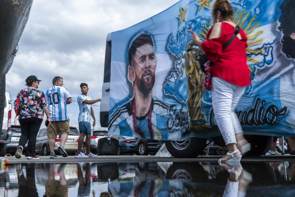 Fans walk by an image of Inter Miami’s Lionel Messi as they arrive to attend an MLS game against the <a class="link " href="https://sports.yahoo.com/soccer/teams/new-york-red-bulls/" data-i13n="sec:content-canvas;subsec:anchor_text;elm:context_link" data-ylk="slk:New York Red Bulls;sec:content-canvas;subsec:anchor_text;elm:context_link;itc:0">New York Red Bulls</a> at Red Bull Arena, Saturday, Aug. 26, 2023, in Harrison, N.J. Like these fans, Messi also is a walker (when he’s playing) — and there are theories why. | Eduardo Munoz <a class="link " href="https://sports.yahoo.com/soccer/players/3900857" data-i13n="sec:content-canvas;subsec:anchor_text;elm:context_link" data-ylk="slk:Alvarez;sec:content-canvas;subsec:anchor_text;elm:context_link;itc:0">Alvarez</a>, Associated Press