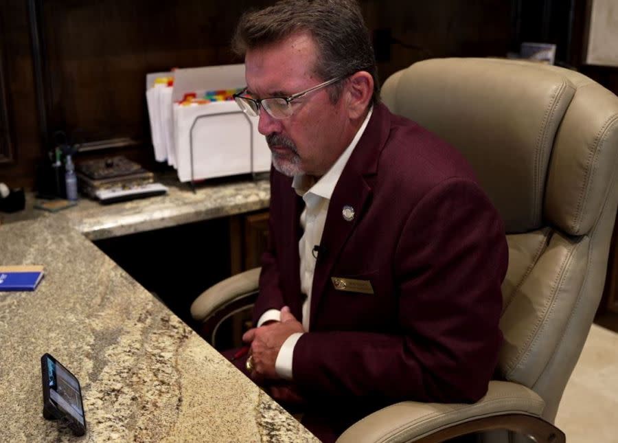 College Station Councilman Bob Yancy watches KXAN’s report (KXAN Photo/Matt Grant)