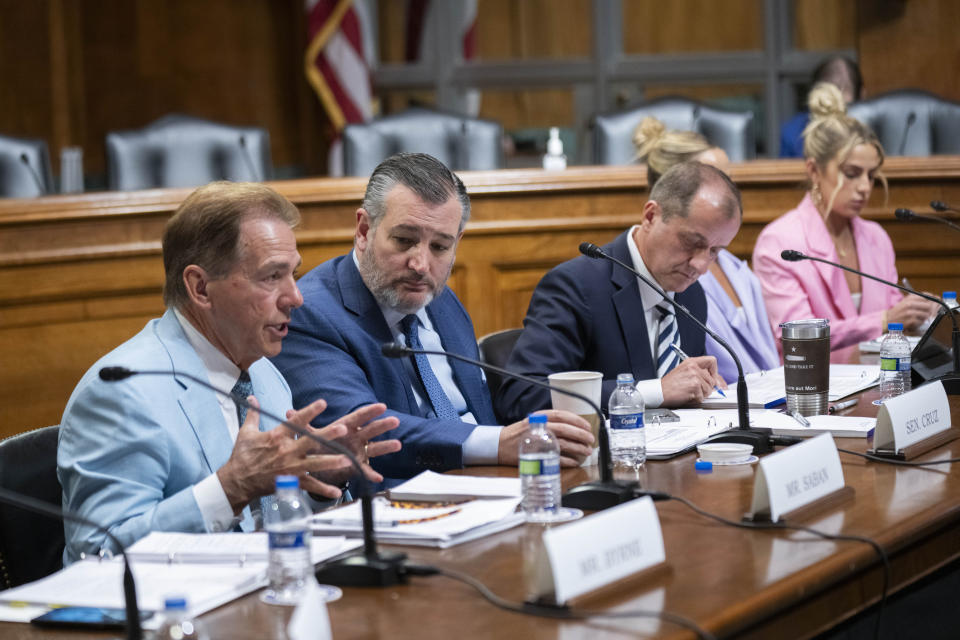 Former Alabama coach Nick Saban and Sen. Ted Cruz speak during a roundtable on the future of college athletics. (AP Photo/Manuel Balce Ceneta)