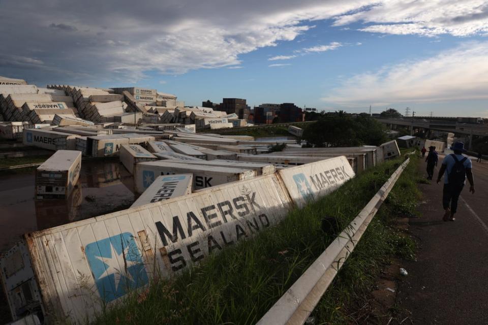 Hundreds of shipping containers washed away by recent flood waters near the Port of Durban in South Africa, 13 April 2022 (EPA)