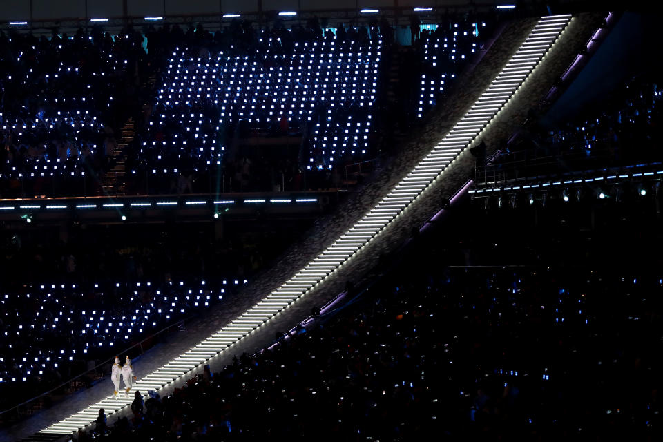 <p>The Olympic torch is carried to the cauldron during the Opening Ceremony of the PyeongChang 2018 Winter Olympic Games at PyeongChang Olympic Stadium on February 9, 2018 in Pyeongchang-gun, South Korea. (Photo by Ronald Martinez/Getty Images) </p>