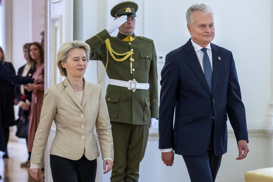 Lithuania's President Gitanas Nauseda, right, and European Commission President Ursula von der Leyen, left, arrive for their meeting at the Presidential palace in Vilnius, Lithuania, Thursday, May 9, 2024. (AP Photo/Mindaugas Kulbis)