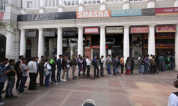 Indian people line up to change old Indian rupee notes outside Connaught place banks and ATMs, in New Delhi, India, 02 December 2016.