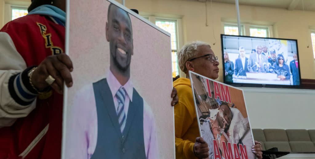 memphis, tn january 23 activists hold signs showing tyre nichols as attorney ben crump is seen speaking on a monitor during a press conference at mt olive cathedral cme church addressing video footage of the violent police encounter that led to nichols death in memphis, tn on january 23, 2023 photo by brandon dill for the washington post via getty images