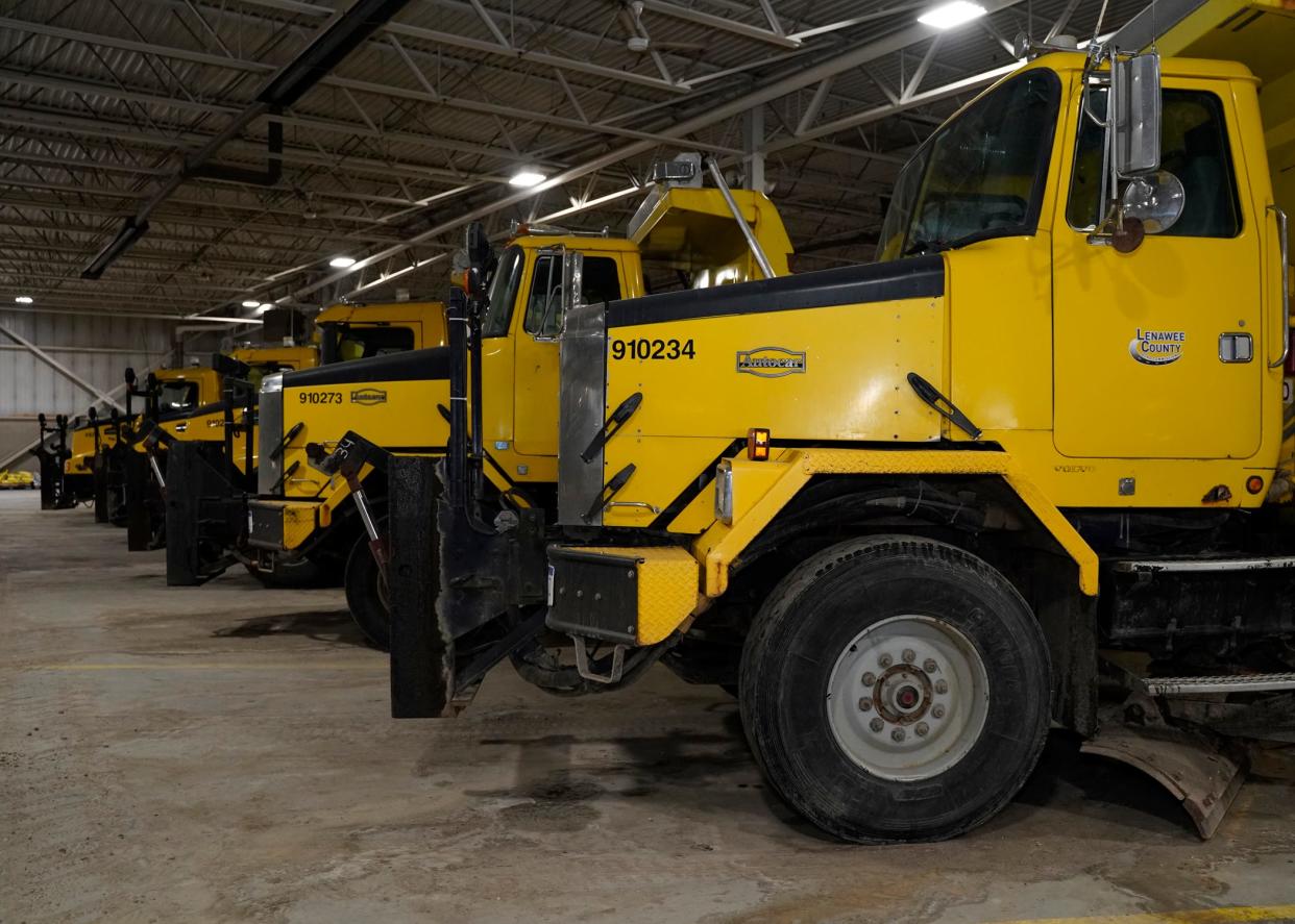 Lenawee County Road Commission trucks stand ready Monday ahead of the winter storm that is expected to arrive Wednesday.