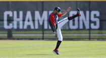 Atlanta Braves outfielder Eddie Rosario loosens up as he arrives for his first day of practice with the team at baseball spring training in North Port, Fla., Thursday, March 17, 2022. (Curtis Compton/Atlanta Journal-Constitution via AP)