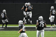 Las Vegas Raiders tight end Foster Moreau (87) celebrates after Las Vegas Raiders fullback Alec Ingold, left, scored a touchdown against the New Orleans Saints during the first half of an NFL football game, Monday, Sept. 21, 2020, in Las Vegas. (AP Photo/David Becker)