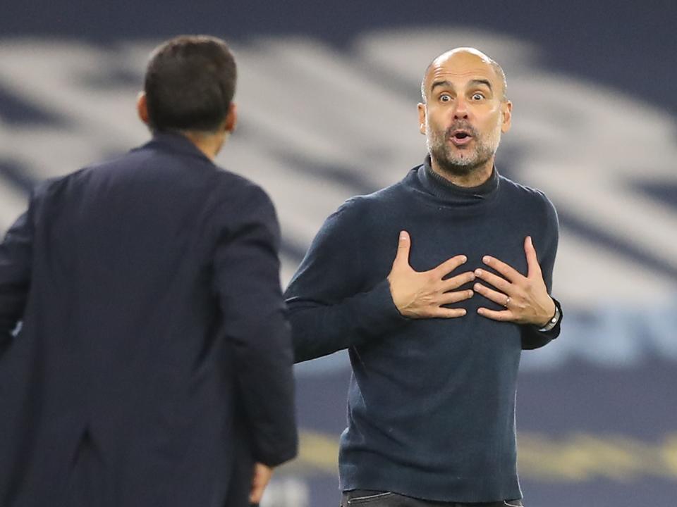 Manchester City manager Pep Guardiola and Sergio Conceicao (POOL/AFP via Getty Images)