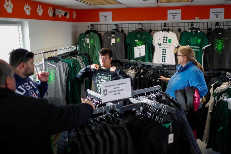 Lexington Sporting Club fans look through the team store before the club’s first home match against Forward Madison FC at Toyota Stadium in Georgetown. LSC had two merchandise locations open for Saturday’s home debut.