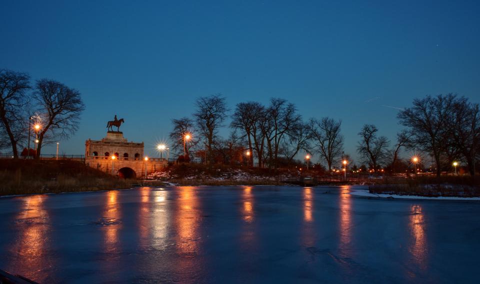 Building stands over a frozen lake at night