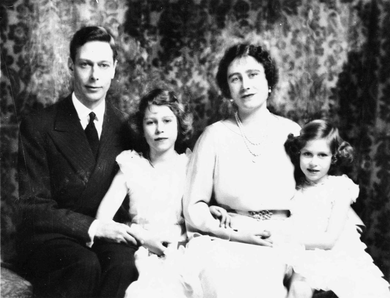 Britain's Queen Elizabeth is shown with her husband, King George VI, and their two daughters, Princess Elizabeth, center, and Princess Margaret, in 1937.  