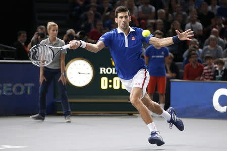 World number one Novak Djokovic of Serbia returns to Britain's Andy Murray during their men's singles final tennis match at the Paris Masters tennis tournament November 8, 2015. REUTERS/Charles Platiau