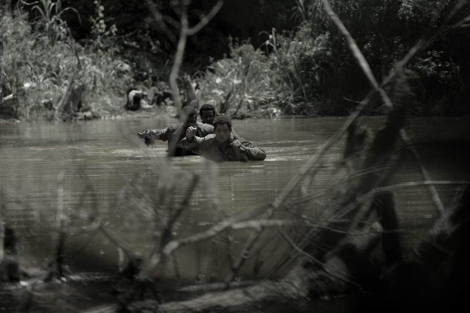 Peter (Will Smith), Gordon (Gilbert Owuor) and John (Michael Luwoye) navigate the swamps of Louisiana after escaping their plantation owners.