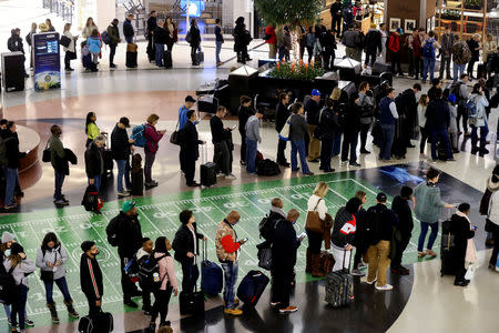 Long lines are seen at a Transportation Security Administration (TSA) security checkpoint at Hartsfield-Jackson Atlanta International Airport amid the partial federal government shutdown, in Atlanta, Georgia, U.S., January 18, 2019. REUTERS/Elijah Nouvelage