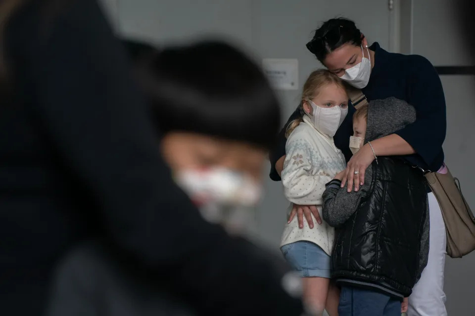 Children and parents line up to receive BioNTech COVID-19 vaccine at Hong Kong Children's Hospital on February 16, 2022 in Hong Kong, China. Hong Kong approved to offer COVID-19 vaccines to children as young as 3 years old as infections rage through the semi-autonomous Chinese city.