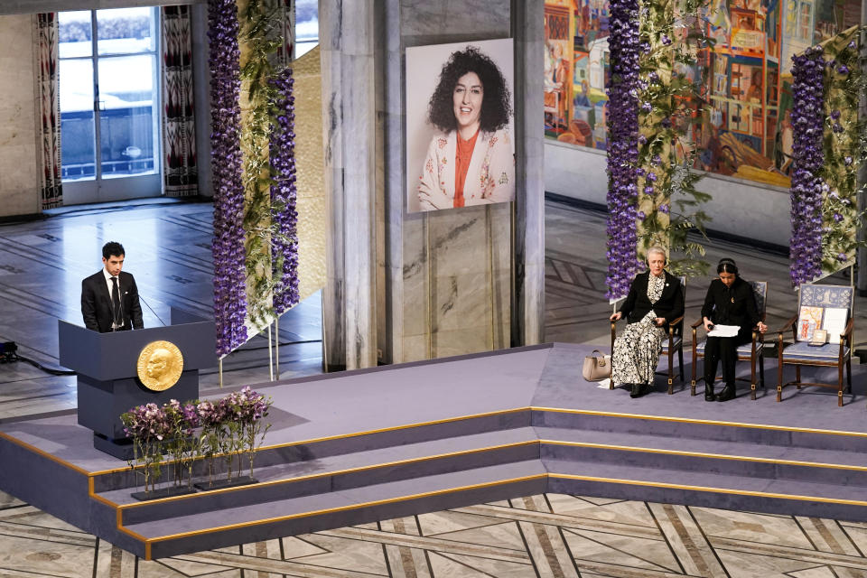 Ali Rahmani gives part of the Nobel Peace Prize lecture in his mother’s name, imprisoned Iranian activist Narges Mohammadi during the awarding of the Nobel Peace Prize for 2023 in Oslo City Hall, Oslo, Norway, Sunday, Dec. 10, 2023. Mohammadi is renowned for campaigning for women's rights and democracy in her country, as well as fighting against the death penalty. (Fredrik Varfjell/NTB via AP)