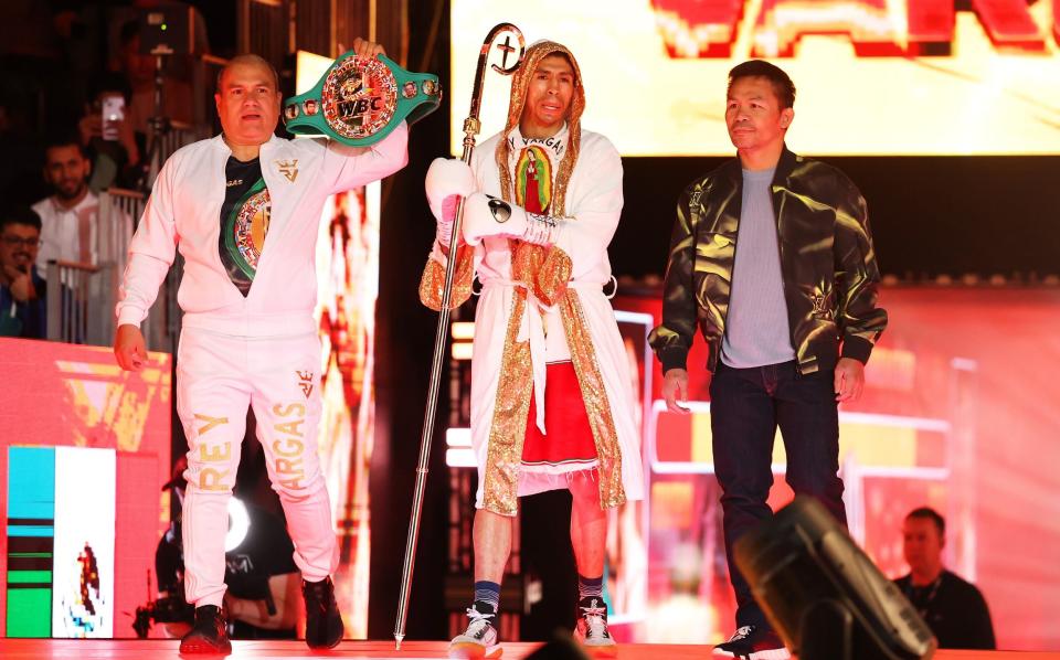 Rey Vargas enters the arena to begin his ring-walk beside a member of coaching staff and Manny Pacquiao ahead of the WBC World Featherweight title fight between Rey Vargas and Nick Ball on the Knockout Chaos boxing card at the Kingdom Arena on March 08, 2024 in Riyadh, Saudi Arabia