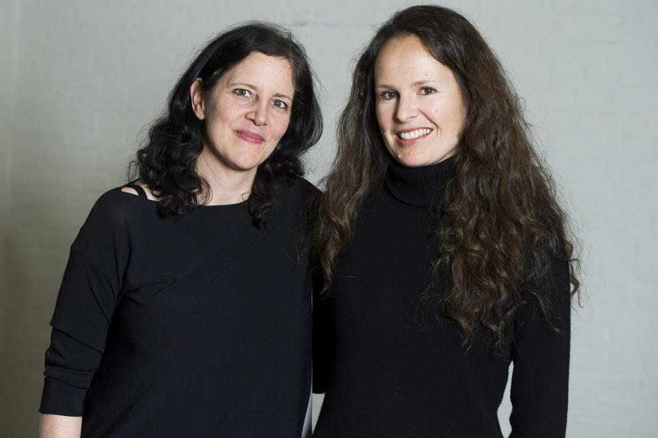 This April 16, 2014 photo shows Laura Poitras, left, and Johanna Hamilton in New York to promote their documentary film "1971," premiering Friday at the Tribeca Film Festival. (Photo by Charles Sykes/Invision/AP)
