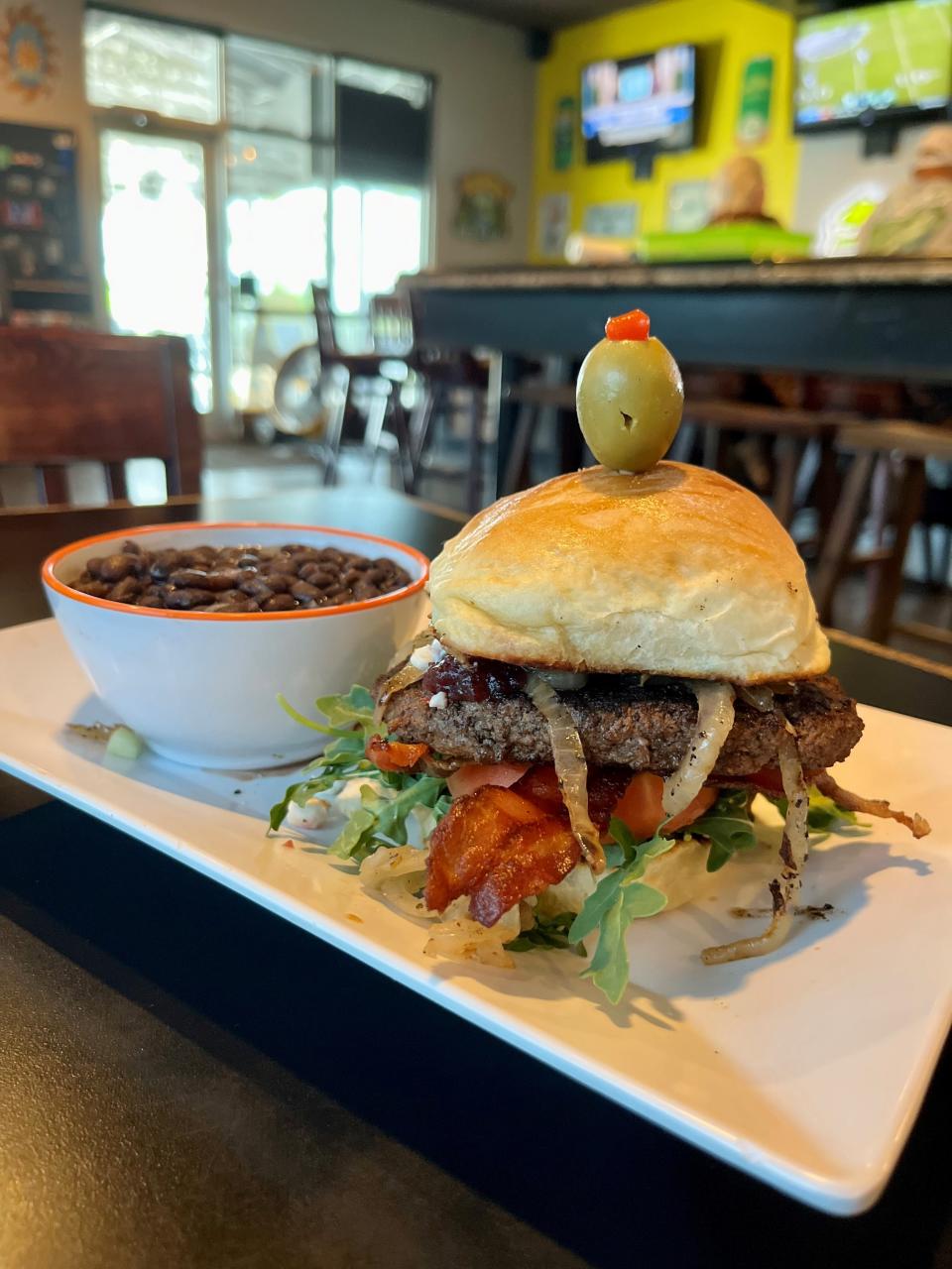 Fat Katz' Crazy Larry burger has peanut butter, bacon, caramelized onions, cranberry relish, arugula and goat cheese.