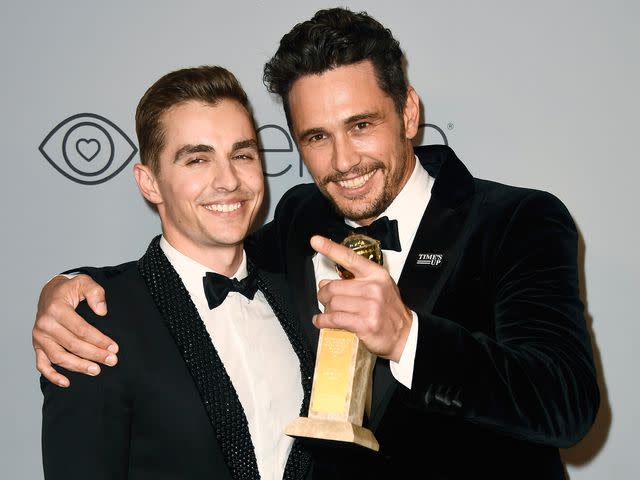 <p>Frazer Harrison/Getty</p> Dave Franco (L) and filmmaker-actor James Franco attend the 19th Annual Post-Golden Globes Party