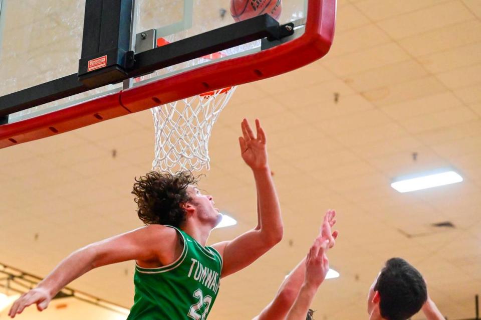 Tumwater forward Ryan Otton (22) looks over his shoulder to see if his off-balance shot went through the basket during the third quarter of a non-league game against Capital in Olympia on Saturday, Jan. 22, 2022.