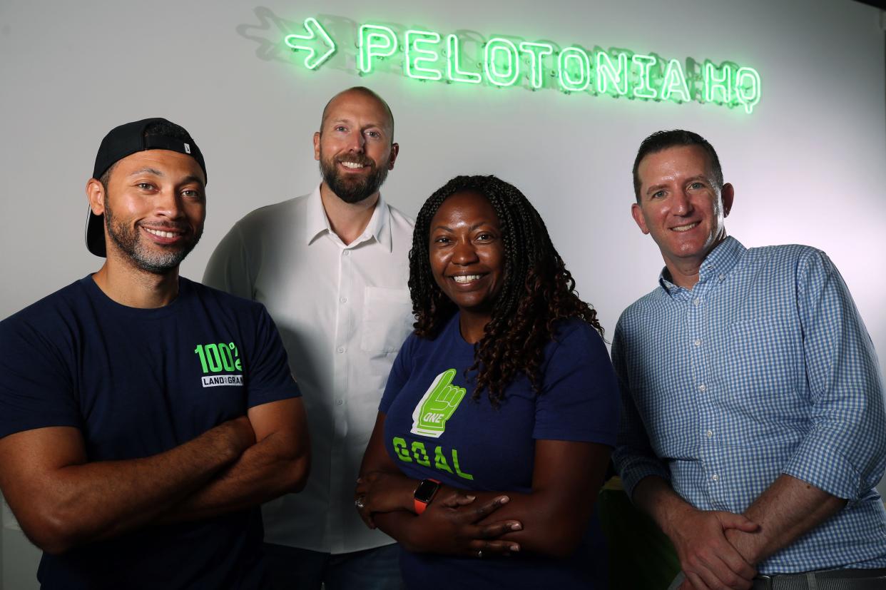 Director of Creative Marketing Jon Tolbert (left), President Joe Apgar, Chief Marketing Officer Alida Smith and CEO Doug Ulman get together at the Pelotonia office, 450 W. Broad St. Apgar said this year's ride weekend, Aug. 5-7, should raise more than $20 million for innovative cancer research at the Ohio State University Comprehensive Cancer Center.