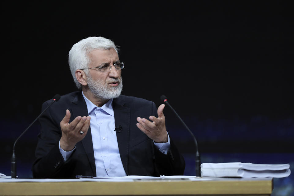 In this photo made available by Iranian state-run TV, IRIB, Iranian presidential candidate Saeed Jalili, a hard-line former nuclear negotiator, speaks during a debate with reformist candidate Masoud Pezeshkian at the TV studio in Tehran, Iran, Monday, July 1, 2024. (Morteza Fakhri Nezhad/IRIB via AP)