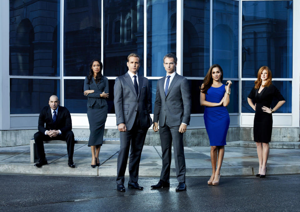 SUITS -- Season: 2 -- Pictured: (l-r) Rick Hoffman as Louis Litt, Gina Torres as Jessica Pearson, Gabriel Macht as Harvey Specter, Patrick J. Adams as Mike Ross, Meghan Markle as Rachel Zane, Sarah Rafferty as Donna -- (Photo by: Robert Ascroft/USA Network/NBCU Photo Bank/NBCUniversal via Getty Images)