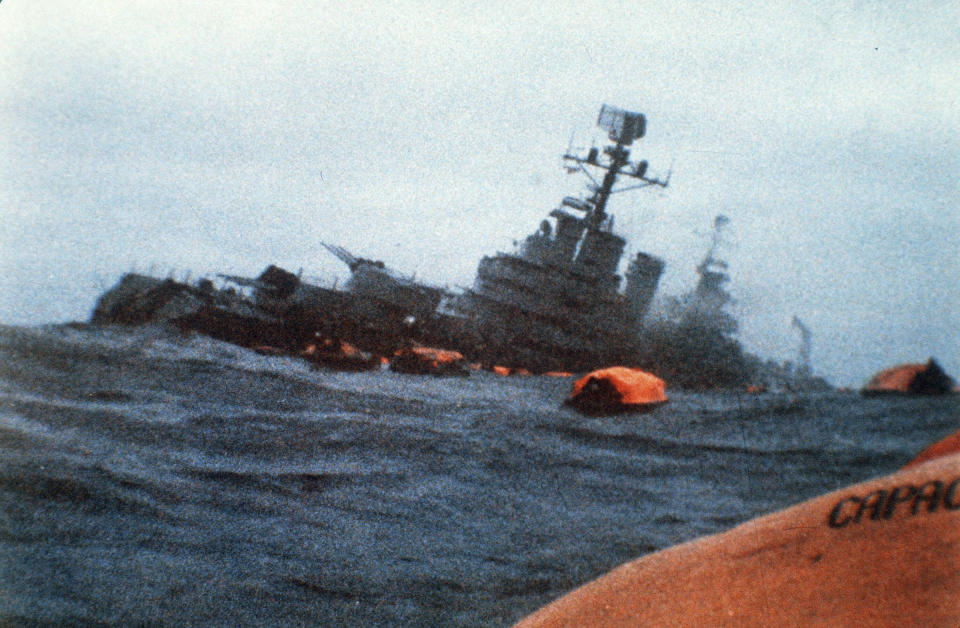 FILE - In this May 1, 1982 file photo, the Argentine cruiser General Belgrano sinks in the South Atlantic Ocean, after being torpedoed by the British Royal Navy during the Falklands conflict. The war was one of the great postwar crises to hit Britain, the latest of which relates to its struggles to exit the European Union. (AP Photo/File)