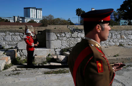 A member of the Royal Gibraltar Regiment plays a bagpipe before the 21-gun salute to mark the 67th anniversary of Britain's Queen Elizabeth's accession to the throne, in front of the Rock in the British overseas territory of Gibraltar, historically claimed by Spain February 6, 2019. REUTERS/Jon Nazca