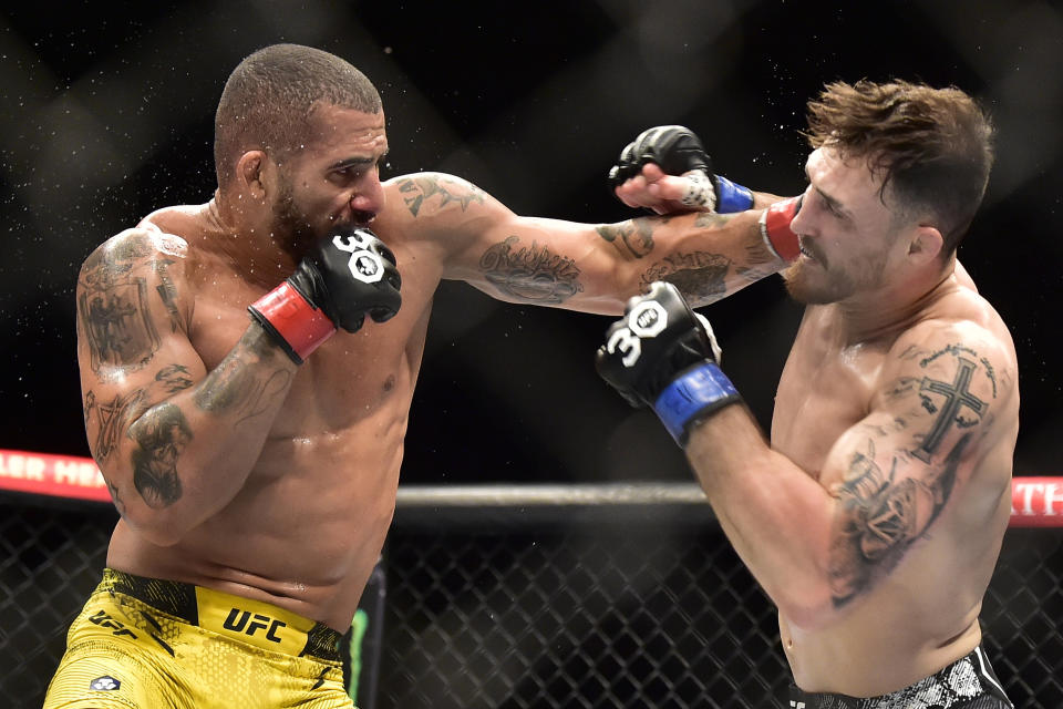 Nov 4, 2023; Sao Paulo, Brazil; Vitor Petrino (red gloves) fights Modestas Bukauskas (blue gloves) during UFC Fight Night at Ibirapuera Arena. Mandatory Credit: Jason da Silva-USA TODAY Sports