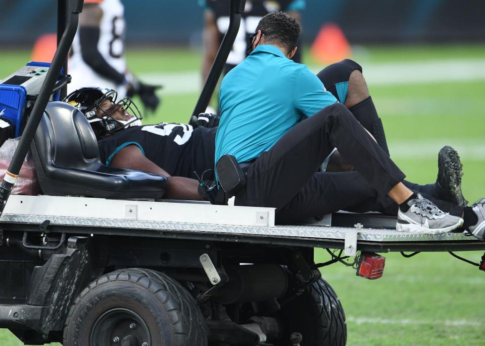 Jacksonville Jaguars defensive tackle DaVon Hamilton (52) taken off the field on a cart after an injury during late game action. The Jacksonville Jaguars hosted the Cleveland Browns Sunday, November 29, 2020 at TIAA Bank Field in Jacksonville, Florida. The Jaguars trailed 13 to 17 at the end of the first half, took a short lived lead in the third quarter but lost with a final score of 25 to 27 to the Browns. [Bob Self/Florida Times-Union]