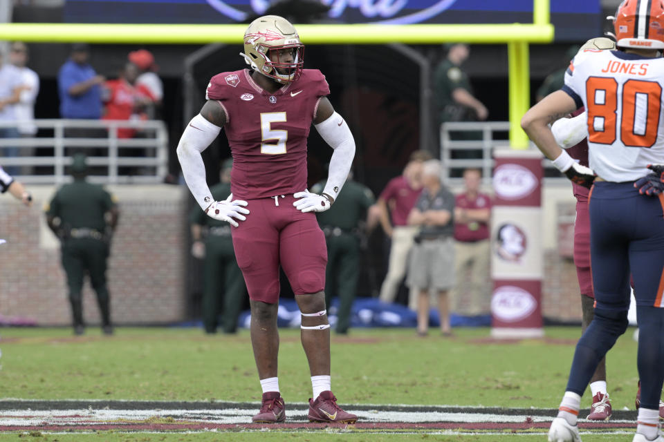 FILE - Florida State defensive lineman Jared Verse (5) sets up for a play during the first half of an NCAA college football game against Syracuse, Saturday, Oct. 14, 2023, in Tallahassee, Fla. Could the fourth-ranked Seminoles, with a victory against defending national champion and No. 6 Georgia in the Orange Bowl be voted No. 1 in the final Associated Press college football poll? While voters say they would be open-minded to it, the current state of college football’s postseason all but renders the conversation moot. (AP Photo (Phelan M. Ebenhack, File)