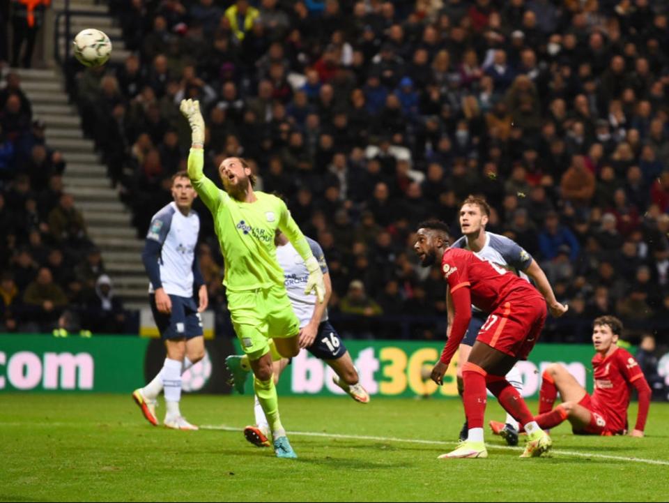 Divock Origi’s backheel loops over the goalkeeper’s head  (Liverpool FC via Getty Images)