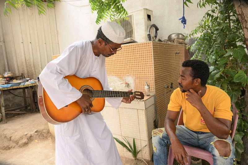 After Sudanese musician wife flees war, Sudanese music professor waits to travel to her in Port Sudan