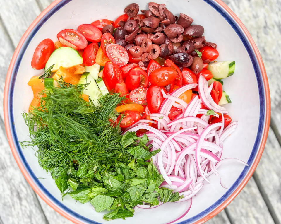 Chambers' Greek salad recipe includes lots of fresh chopped vegetables and herbs.