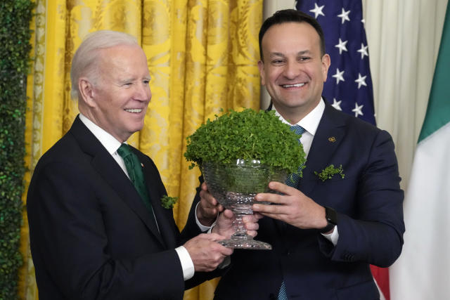 President Joe Biden and Ireland's Taoiseach Leo Varadkar hold a bowl of shamrocks during a St. Patrick's Day reception in the East Room of the White House, Friday, March 17, 2023, in Washington. (AP Photo/Alex Brandon)