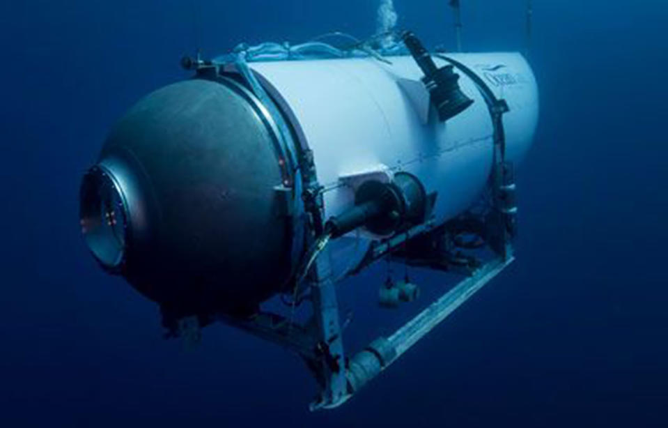 FILE - This undated image provided by OceanGate Expeditions in June 2021 shows the company's Titan submersible. The wrecks of the Titanic and the Titan sit on the ocean floor, separated by 1,600 feet (490 meters) and 111 years of history. How they came together unfolded over an intense week that raised temporary hopes and left lingering questions. (OceanGate Expeditions via AP, File)
