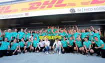 Formula One - Russian Grand Prix - Sochi, Russia - 1/5/16 - Mercedes Formula One drivers Lewis Hamilton of Britain and Nico Rosberg of Germany celebrate with their team. REUTERS/Maxim Shemetov