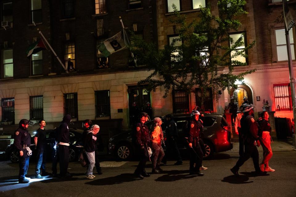 NYPD officers arrest pro-Palestinian demonstrators at Columbia University on Tuesday night. They arrested 109 people on the Ivy League campus after protesters barricaded themselves inside Hamilton Hall on Monday (Getty Images)