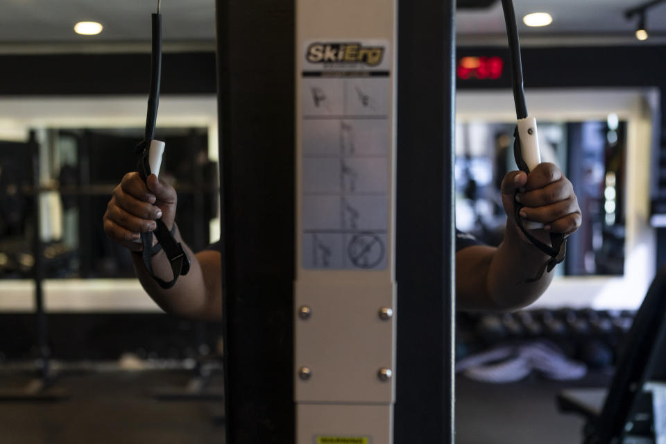 John Simon, a teenager who had a bariatric surgery in 2022, exercises at El Workout Fitness in Los Angeles, Monday, March 13, 2023. (AP Photo/Jae C. Hong)