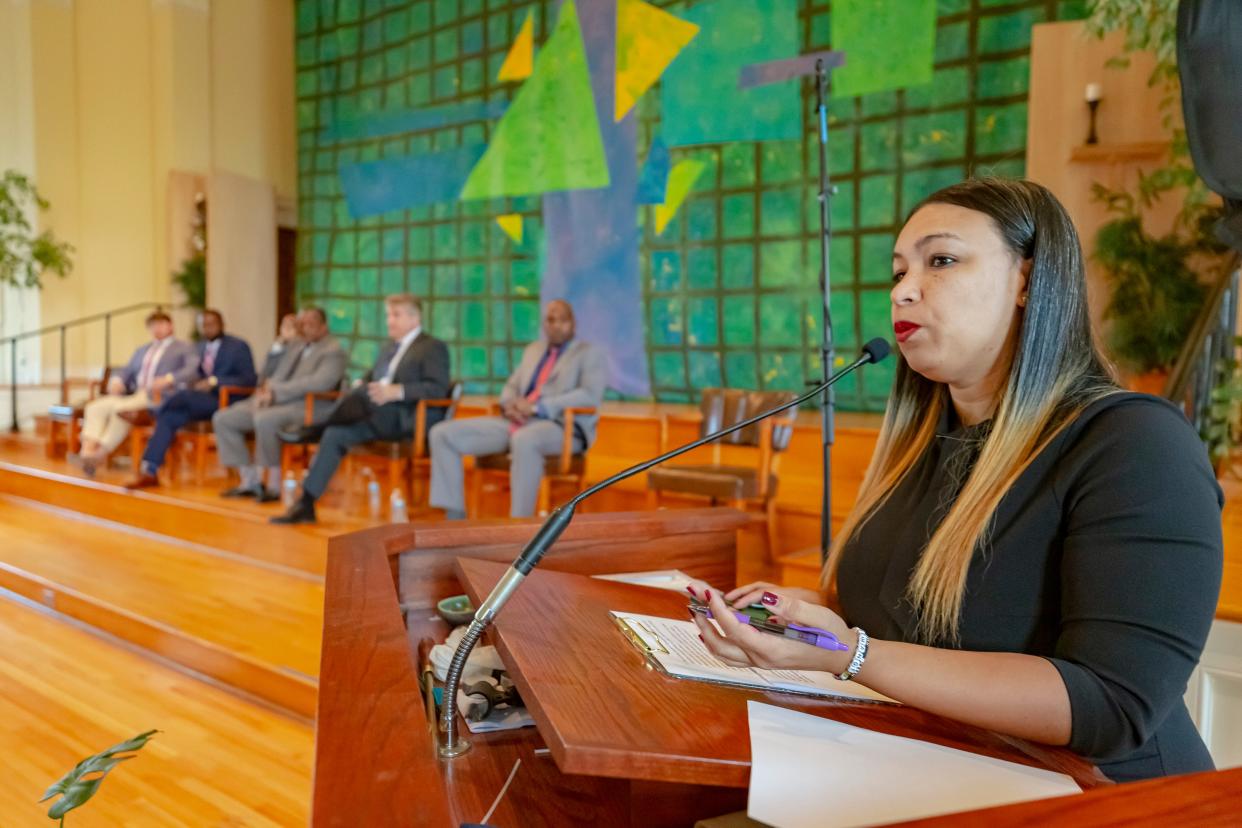 Moderator Theryn C. Bond, right, speaks during a debate hosted by Memphis for All at First Congregational Church on Thursday, March 30, 2023.