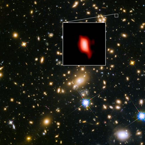 <span class="caption">Galaxy cluster MACS J1149.5+2223 taken with the Hubble Space Telescope. The inset image is the very distant galaxy MACS1149-JD1</span> <span class="attribution"><span class="source">ALMA (ESO/NAOJ/NRAO), NASA/ESA Hubble Space Telescope, W. Zheng (JHU), M. Postman (STScI), the CLASH Team, Hashimoto et al.</span>, <a class="link " href="http://creativecommons.org/licenses/by-sa/4.0/" rel="nofollow noopener" target="_blank" data-ylk="slk:CC BY-SA;elm:context_link;itc:0;sec:content-canvas">CC BY-SA</a></span>