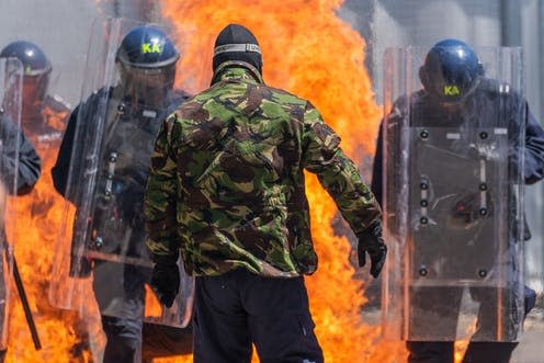 <span class="caption">Violence during the 2011 London riots.</span> <span class="attribution"><a class="link " href="https://www.shutterstock.com/image-photo/uk-police-riots-unit-during-action-1538286845" rel="nofollow noopener" target="_blank" data-ylk="slk:Shutterstock;elm:context_link;itc:0;sec:content-canvas">Shutterstock</a></span>