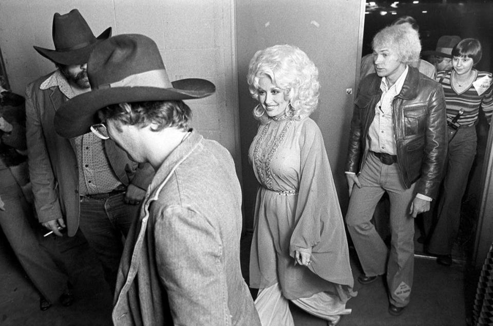 Dec. 2, 1977: Dolly Parton entering Panther Hall in Fort Worth, Texas, with her crew for a concert. There were 1,250 people in the venue’s country music ballroom.