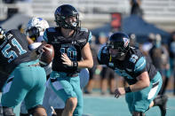 Coastal Carolina quarterback Grayson McCall (10) looks for a receiver during the first half of an NCAA college football game against Appalachian State, Saturday, Nov. 21, 2020, in Conway, S.C. (AP Photo/Richard Shiro)