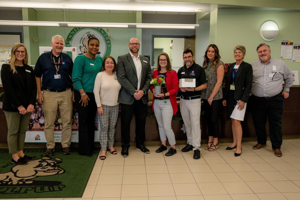 Bunnell Elementary School Assistant Principal Donelle Evensen (fifth from right) and Principal Marcus Sanfilippo (fourth from right) on Monday, Nov. 28, 2022, with the superintendent and her cabinet after being named Flagler Schools Assistant Principal and Principal of the Year.