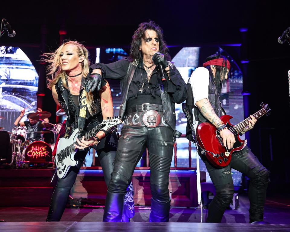 Nita Strauss, left, and Alice Cooper rock out at Wells Fargo Arena in Des Moines.